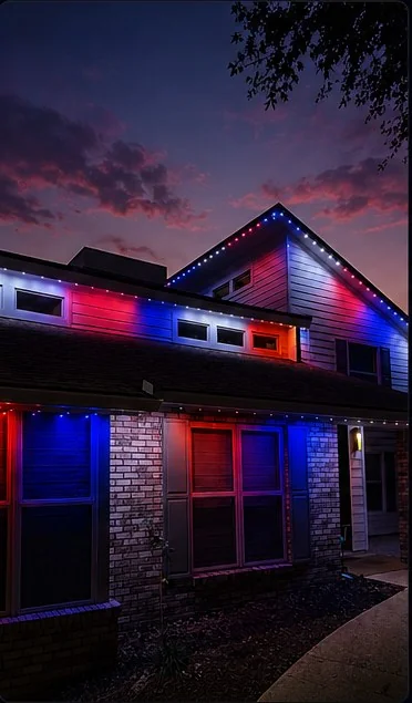 4th of July roofline lighting scene on a two-story home