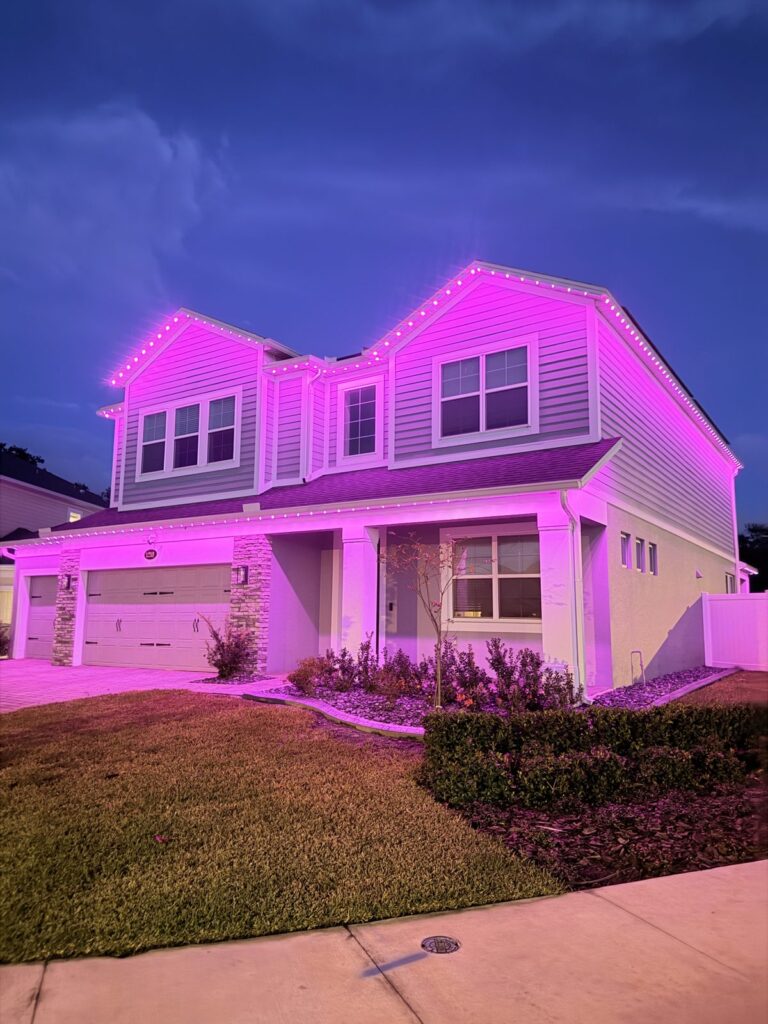 Home lit in magenta at night in Sanford, Florida