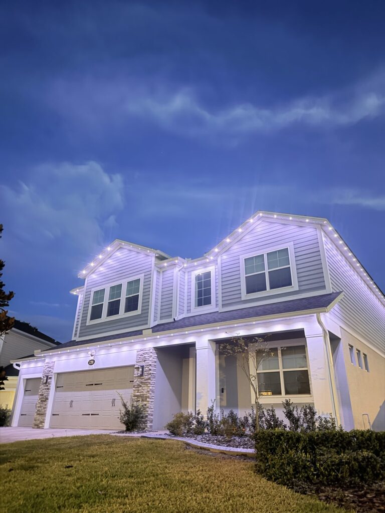 Home with cool white lighting at dusk in Sanford, Florida