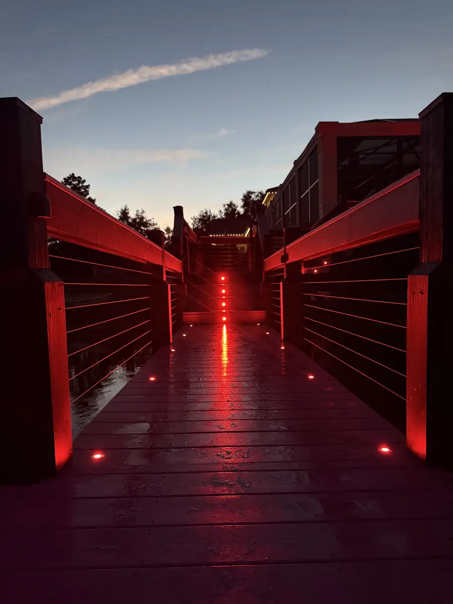 Dock walkway lit in red — game night