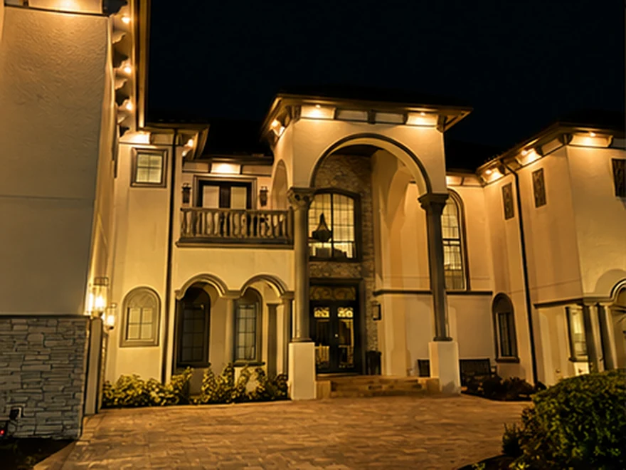 The same home at night with Brighter Nights soffit lighting at 2700K Warm White